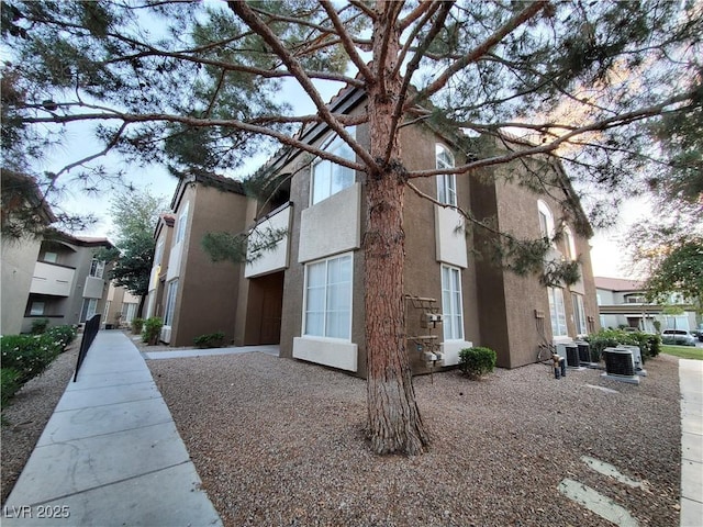 9000 Las Vegas Blvd Unit 1250, Las Vegas, NV 89123 - view of side of home featuring stucco siding and cooling unit