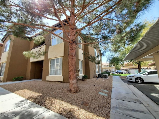 9000 Las Vegas Blvd Unit 1250, Las Vegas, NV 89123 - view of side of home with stucco siding and uncovered parking