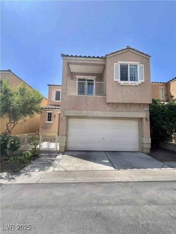 6545 Netherseal Ave, Las Vegas, NV 89139 - multi unit property with a tile roof, stucco siding, a garage, concrete driveway, and fence