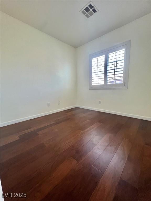 6545 Netherseal Ave, Las Vegas, NV 89139 - empty room with dark wood finished floors and baseboards