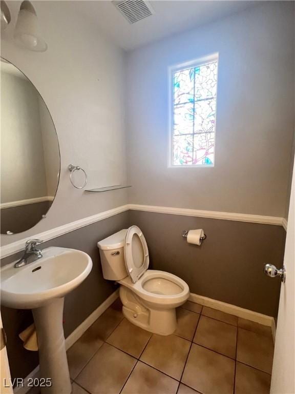 6545 Netherseal Ave, Las Vegas, NV 89139 - bathroom featuring toilet, tile patterned floors, and baseboards
