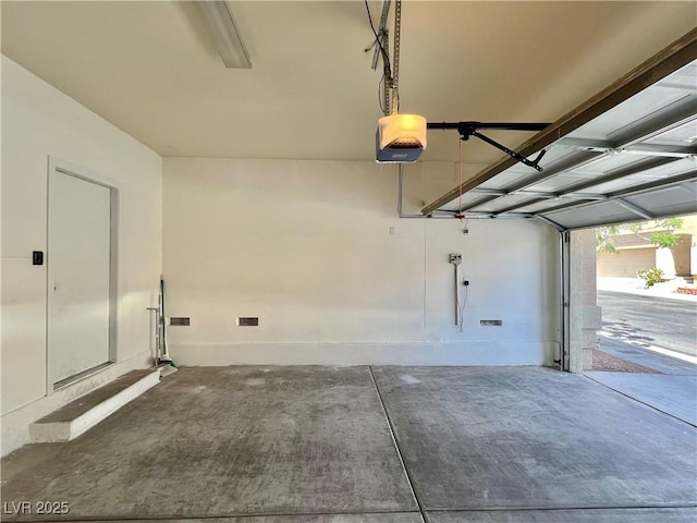 6545 Netherseal Ave, Las Vegas, NV 89139 - garage with baseboards and a garage door opener