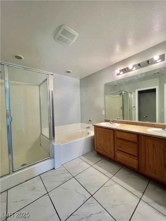 6545 Netherseal Ave, Las Vegas, NV 89139 - full bathroom featuring a garden tub, a stall shower, and double vanity