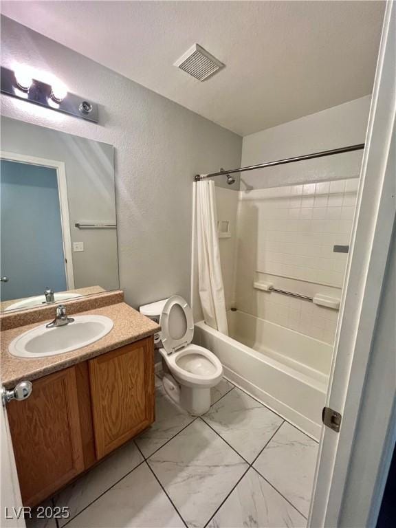6545 Netherseal Ave, Las Vegas, NV 89139 - full bath featuring vanity, marble look tiles, shower / bath combo with shower curtain, and toilet