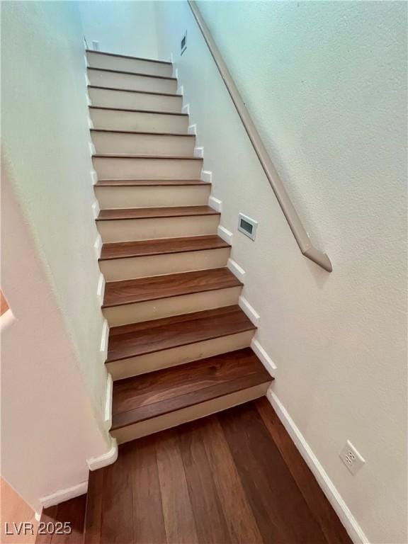 6545 Netherseal Ave, Las Vegas, NV 89139 - staircase with wood finished floors and baseboards