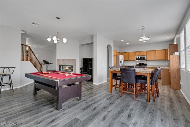 playroom featuring baseboards, light wood-style floors, billiards table, a fireplace, and recessed lighting