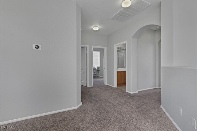 3964 Irvin Ave, Las Vegas, NV 89141 - hall with carpet floors and arched walkways