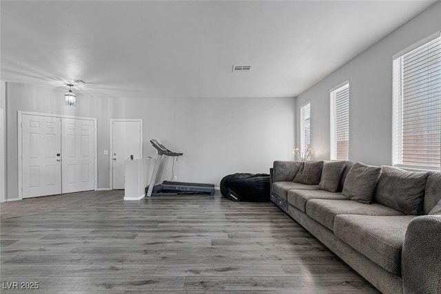 living room with wood finished floors and baseboards