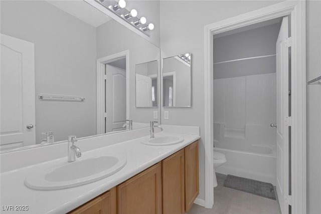 full bath featuring toilet, double vanity, and tile patterned flooring