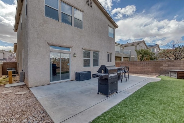 back of property featuring stucco siding and a patio area