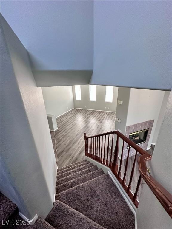 3964 Irvin Ave, Las Vegas, NV 89141 - stairs with wood finished floors and a tiled fireplace