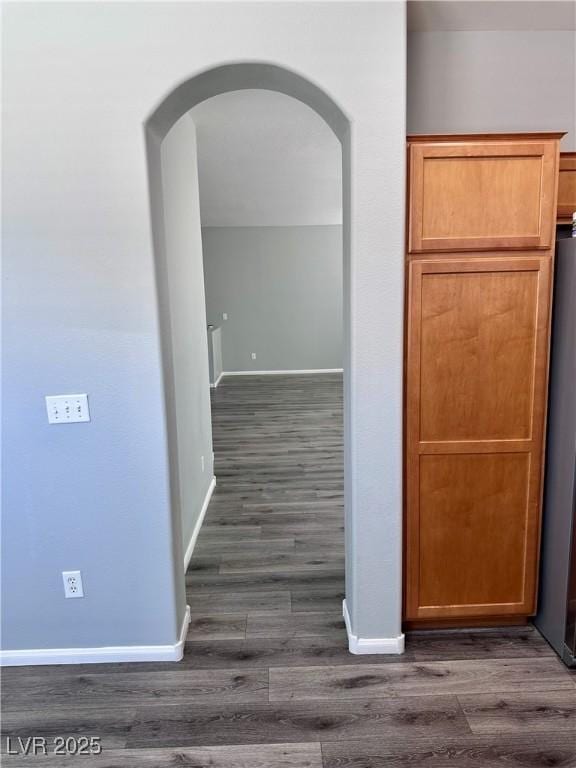 3964 Irvin Ave, Las Vegas, NV 89141 - corridor with dark wood-type flooring and arched walkways