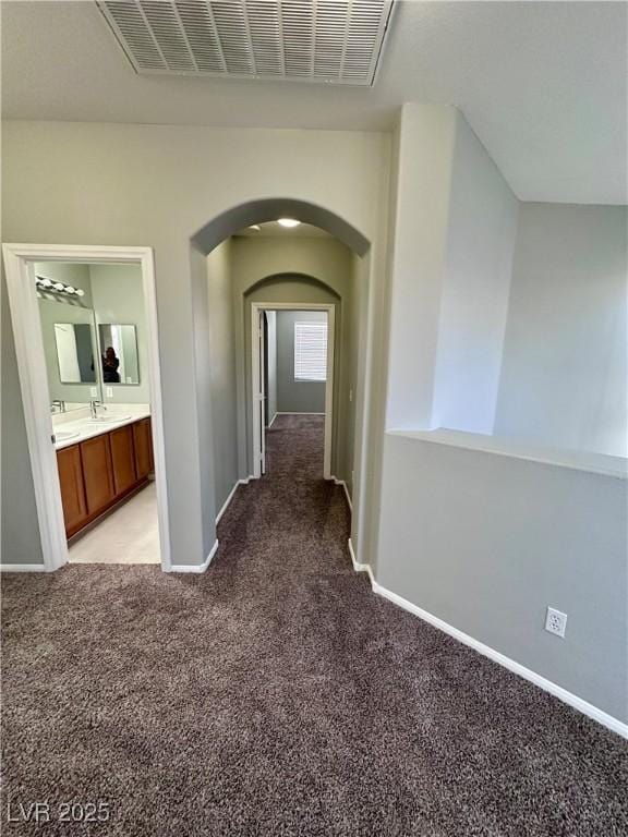 3964 Irvin Ave, Las Vegas, NV 89141 - hall featuring light carpet and arched walkways