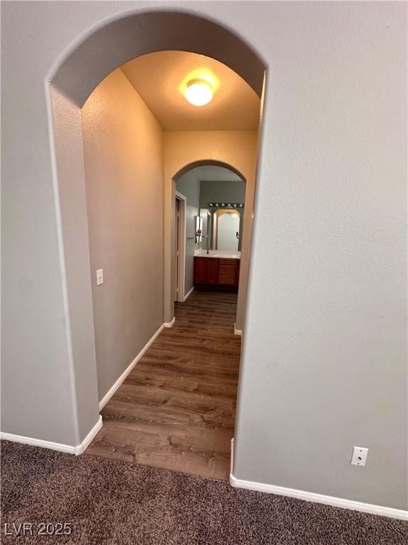 3964 Irvin Ave, Las Vegas, NV 89141 - corridor featuring arched walkways and wood finished floors