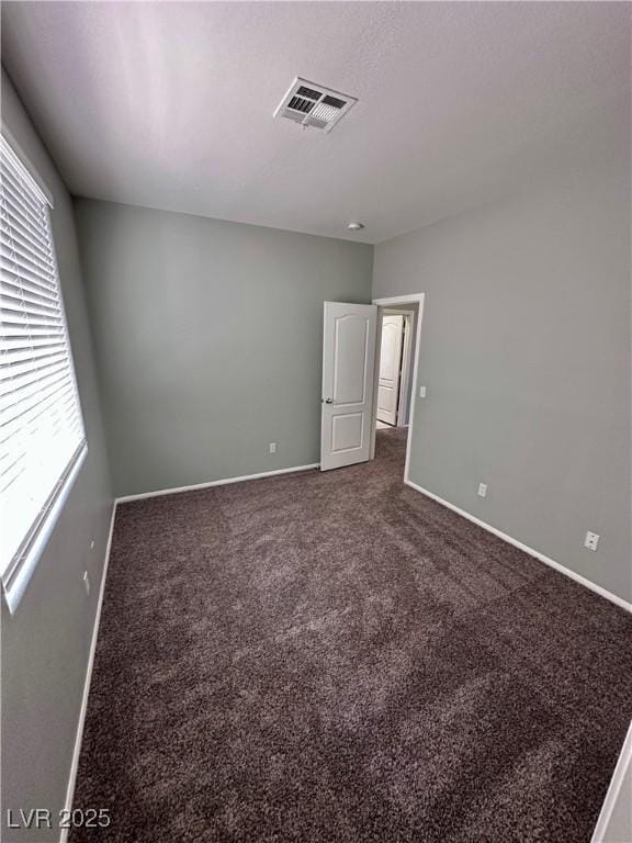 3964 Irvin Ave, Las Vegas, NV 89141 - empty room with dark carpet and baseboards