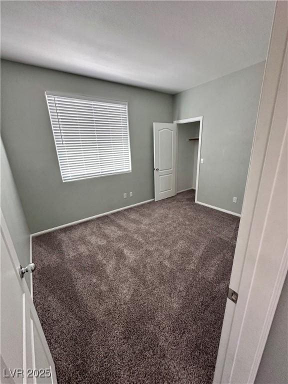 3964 Irvin Ave, Las Vegas, NV 89141 - unfurnished bedroom featuring carpet flooring and baseboards