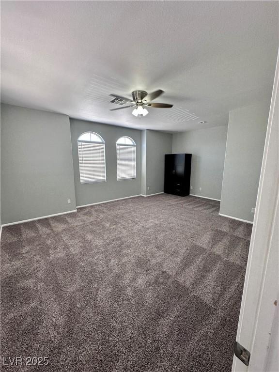 3964 Irvin Ave, Las Vegas, NV 89141 - unfurnished living room with ceiling fan and carpet floors