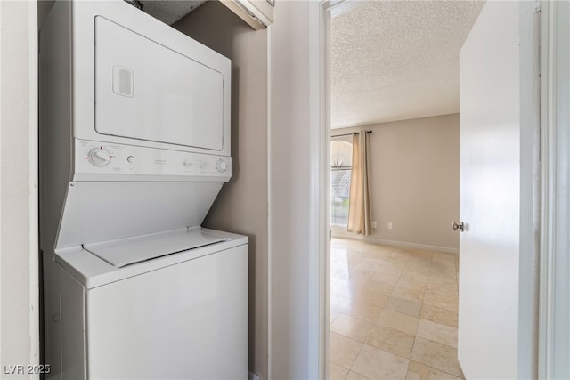3150 Soft Breezes Dr Unit 1216, Las Vegas, NV 89128 - laundry room featuring estacked washer and dryer, a textured ceiling, and baseboards