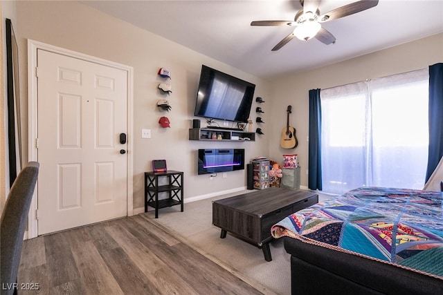 6955 N Durango Dr Unit 2081, Las Vegas, NV 89149 - bedroom with wood finished floors, ceiling fan, and baseboards