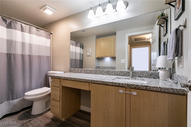 6955 N Durango Dr Unit 2081, Las Vegas, NV 89149 - bathroom with wood finished floors, toilet, and vanity