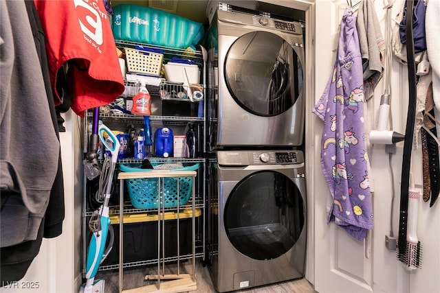 6955 N Durango Dr Unit 2081, Las Vegas, NV 89149 - washroom with stacked washer / dryer and wood finished floors
