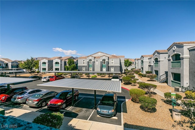 6955 N Durango Dr Unit 2081, Las Vegas, NV 89149 - partially covered parking lot with a residential view