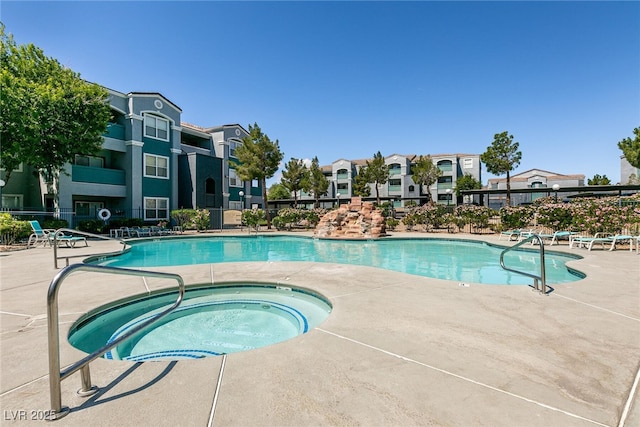 6955 N Durango Dr Unit 2081, Las Vegas, NV 89149 - community pool with a hot tub, a patio area, and a residential view