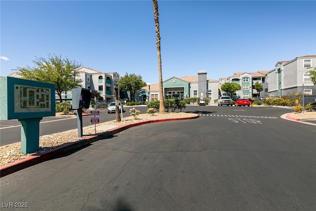 6955 N Durango Dr Unit 2081, Las Vegas, NV 89149 - view of asphalt street featuring a residential view and curbs