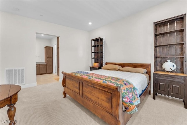 bedroom with light colored carpet, recessed lighting, and baseboards