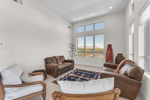 living room featuring baseboards and recessed lighting