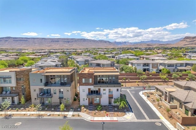 aerial perspective of suburban area featuring a mountain backdrop