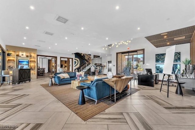 community lobby featuring stairs and recessed lighting