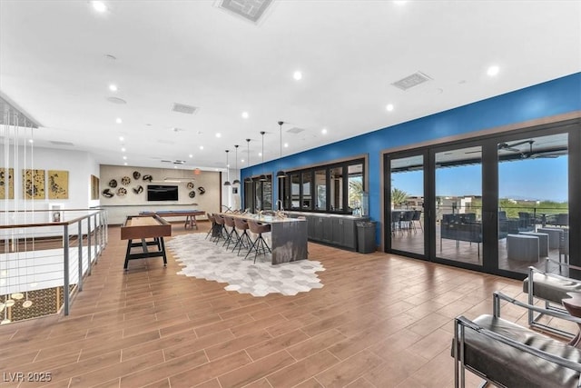 dining room featuring light wood finished floors and recessed lighting