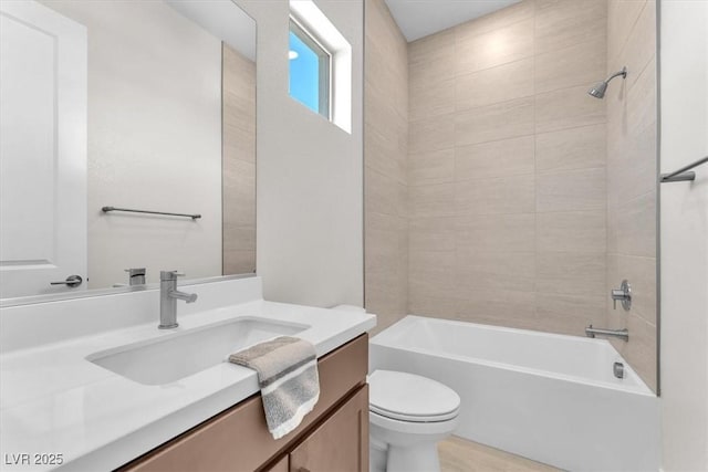 full bathroom featuring toilet, vanity, and washtub / shower combination