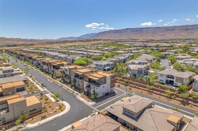 aerial perspective of suburban area with a mountainous background