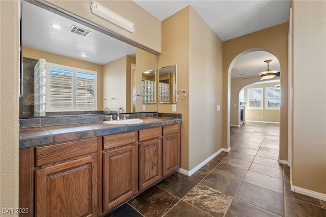 8547 Benidorm Ave, Las Vegas, NV 89178 - bathroom featuring vanity, baseboards, and a ceiling fan
