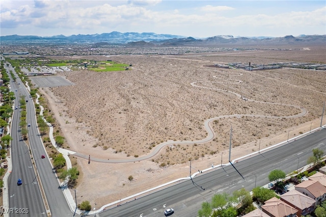 8547 Benidorm Ave, Las Vegas, NV 89178 - drone / aerial view of a main thoroughfare, a mountainous background, and a desert landscape