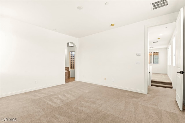 1252 Casa Palermo Cir, Henderson, NV 89011 - unfurnished room with light colored carpet, arched walkways, and baseboards