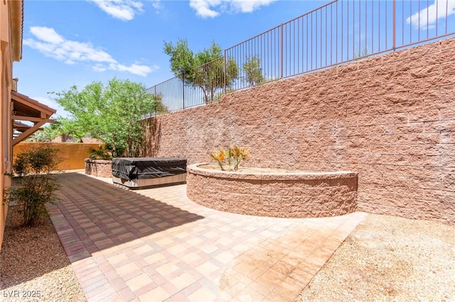 1252 Casa Palermo Cir, Henderson, NV 89011 - view of patio / terrace with a fenced backyard and a hot tub