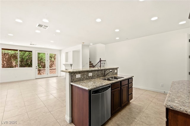 1252 Casa Palermo Cir, Henderson, NV 89011 - kitchen with stainless steel dishwasher, a sink, light tile patterned floors, open floor plan, and an island with sink