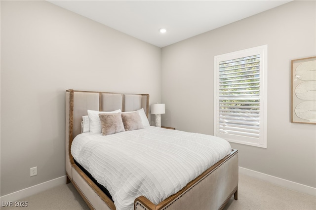 bedroom featuring light carpet, baseboards, and recessed lighting
