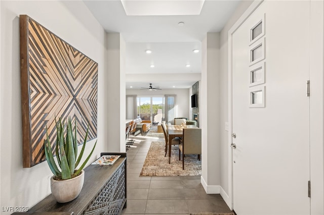 entrance foyer with tile patterned flooring, recessed lighting, a ceiling fan, and baseboards