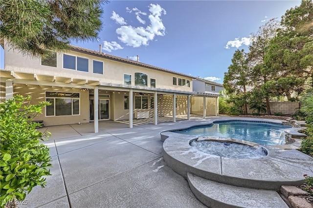 386 Wiseton Ave, Las Vegas, NV 89183 - view of swimming pool featuring a patio area, a fenced backyard, and a pool with connected hot tub