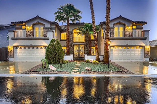 386 Wiseton Ave, Las Vegas, NV 89183 - mediterranean / spanish home with a balcony, an attached garage, and french doors