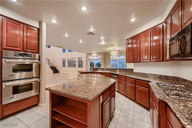 386 Wiseton Ave, Las Vegas, NV 89183 - kitchen featuring appliances with stainless steel finishes, light tile patterned flooring, a sink, dark stone counters, and open shelves