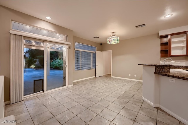 386 Wiseton Ave, Las Vegas, NV 89183 - unfurnished dining area featuring light tile patterned flooring, baseboards, recessed lighting, and wet bar