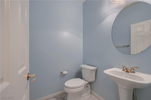 386 Wiseton Ave, Las Vegas, NV 89183 - bathroom with tile patterned flooring, toilet, baseboards, and a sink