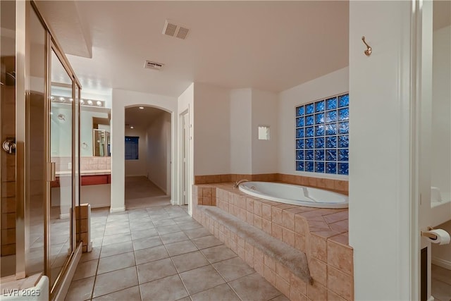 386 Wiseton Ave, Las Vegas, NV 89183 - full bathroom with tile patterned floors and a garden tub