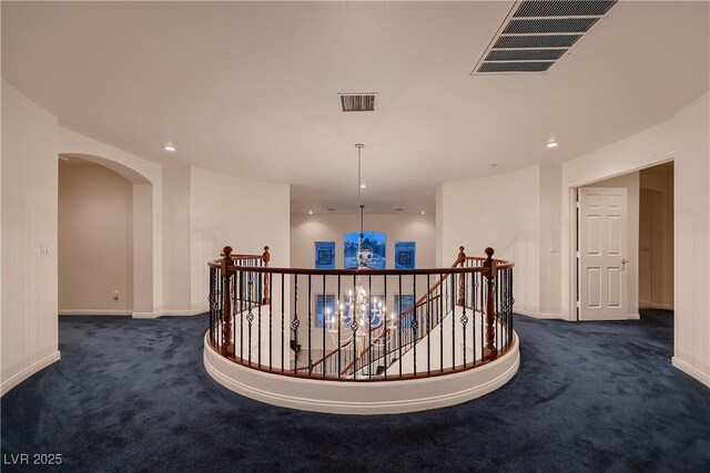 386 Wiseton Ave, Las Vegas, NV 89183 - corridor with an upstairs landing, dark carpet, arched walkways, baseboards, and recessed lighting