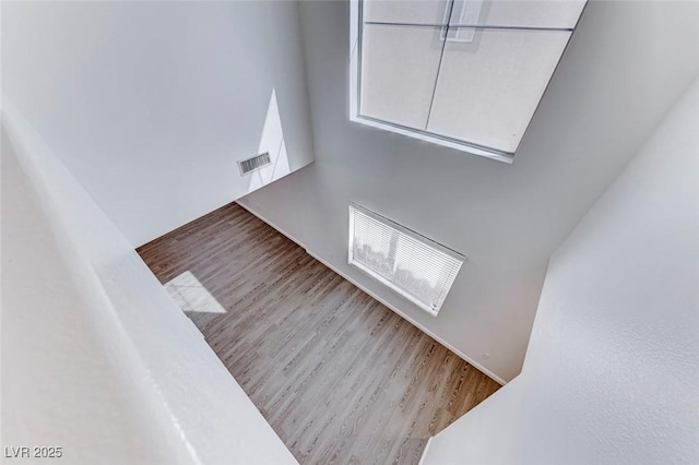 11028 Meadow Leaf Ave, Las Vegas, NV 89144 - unfurnished living room with wood finished floors